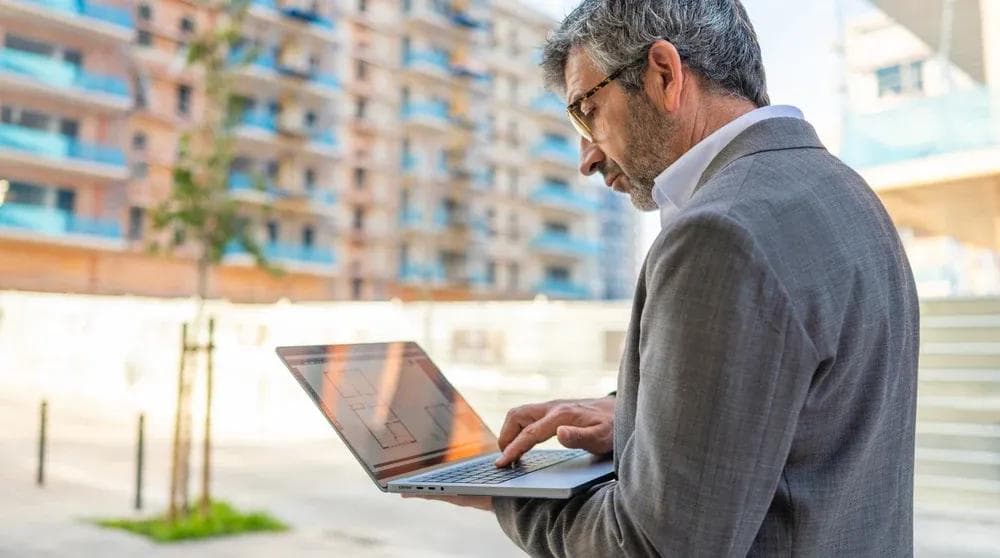 Business professional reviewing backlink strategy on laptop for local SEO