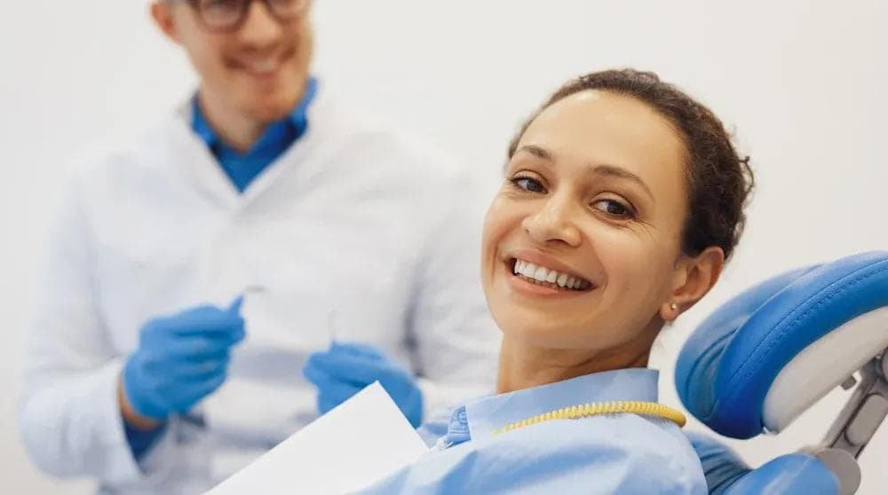 Dentist with patient in modern dental clinic representing local SEO for dental practices