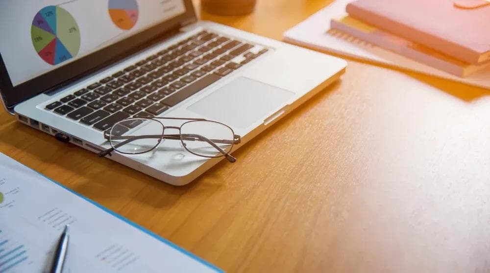 Person at a laptop performing keyword research for local SEO strategy